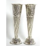 A pair of late Victorian silver trumpet shaped spill vases, Carrington & Co, London 1897, 20.5cm