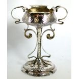 An Edwardian Arts & Crafts silver twin handled pedestal bowl/cup, Evans & Co, Birmingham 1908,