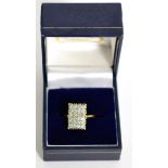 A diamond rectangular plaque ring, pavé set with round brilliant cut diamonds, total estimated