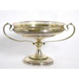 A silver pedestal comport, Manoah Rhodes & Sons Ltd, London 1912, with pierced rim and twin handles,