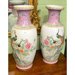 A pair of large famille rose decorated vases