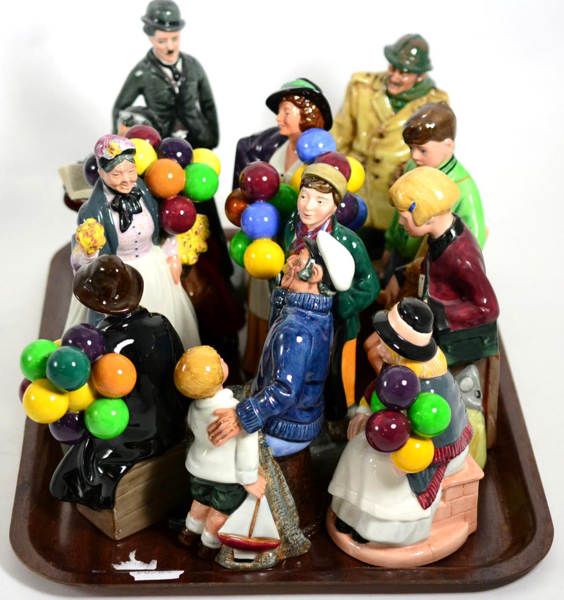 A group of eleven Royal Doulton figures including The Boy Evacuee 3069/9500; Charlie Chaplin 499/