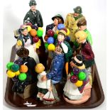 A group of eleven Royal Doulton figures including The Boy Evacuee 3069/9500; Charlie Chaplin 499/