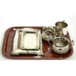 Miscellaneous group of silver wares, including a photo frame, cream jug and sucrier and two