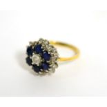 A sapphire and diamond cluster ring, total estimated diamond weight 0.45 carat approximately, finger