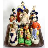 A group of assorted Staffordshire pottery figures