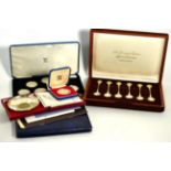 The Sovereign Queens spoons, a set of six commemorative parcel gilt spoons, with certificate and