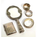 A group of silver to include mirror; cigarette case; napkin rings etc