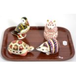 Four Royal Crown Derby paperweights, tortoise; hamster (gold coloured stopper); hedgehog (silver