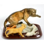 A Beswick pottery model of a puma and three others