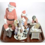 A Lladro model of a snowman; another of Father Christmas; two Nao models of Father Christmas; and