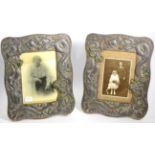 A pair of Oriental photograph frames, circa 1900, decorated in relief with trailing dragons, 32cm,