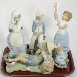 Two Lladro figures of boys; and three Nao examples of girls