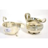 A George III Regency silver cream jug, London 1819; and a modern silver sauce boat by Deakin &