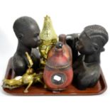 A Benin brass ''Queen Mother'' bust, two decanters, four African carvings, a brass crocodile and