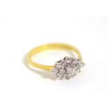 An 18 carat gold diamond cluster ring, total estimated diamond weight 0.40 carat approximately,