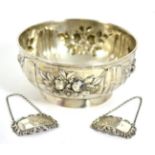 A German silver rose bowl, repousse decorated with floral reserves; and a pair of modern silver