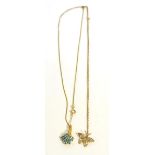 A 14 carat gold blue topaz and diamond pendant on chain necklace and a butterfly pendant on chain (