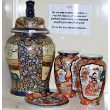 A large Oriental porcelain vase and cover; a pair of further vases and a pair of matching plates