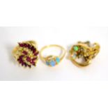 A 14 carat gold opal ring, an opal and seed pearl brooch and a ruby cluster ring, stamped '585' (3)