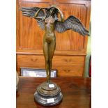 A bronze figure of a winged maiden