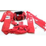 A Ferrari F1 Team Kit Bag, comprising a holdall, a red leather mobile phone case, boxed, two pairs