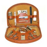Riley Interest: A 1950s Light Brown Leather Zip Operated Travelling Case, fitted with scissors, nail