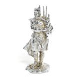 A Chrome Plated on Brass Car Mascot in the form of a Scots Piper, 15.5cm high Buyer's premium of 20%