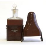 A 1920s Bentley Lady's Travelling Perfume Bottle, with brown leather outer case containing glass