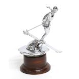 A 1931 Riley Ski Lady Chrome Car Mascot, mounted on a threaded radiator cap and circular wooden
