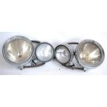 A Pair of 5in Chrome Spot Lamps; and a pair of 7in chrome headlamps on metal mounting brackets (4)