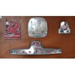 Four Chromed and Enamel Bedford Motor Vehicle Badges, mounted on a wooden board Buyer's premium of