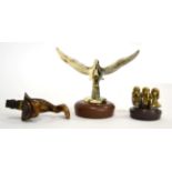 Three Brass Car Mascots, comprising an Edwardian mascot in the form of a stylised dolphin, 10cm