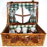 A Wicker Picnic Basket, reputedly from a Rolls Royce 2025, with green and white tartan interior,