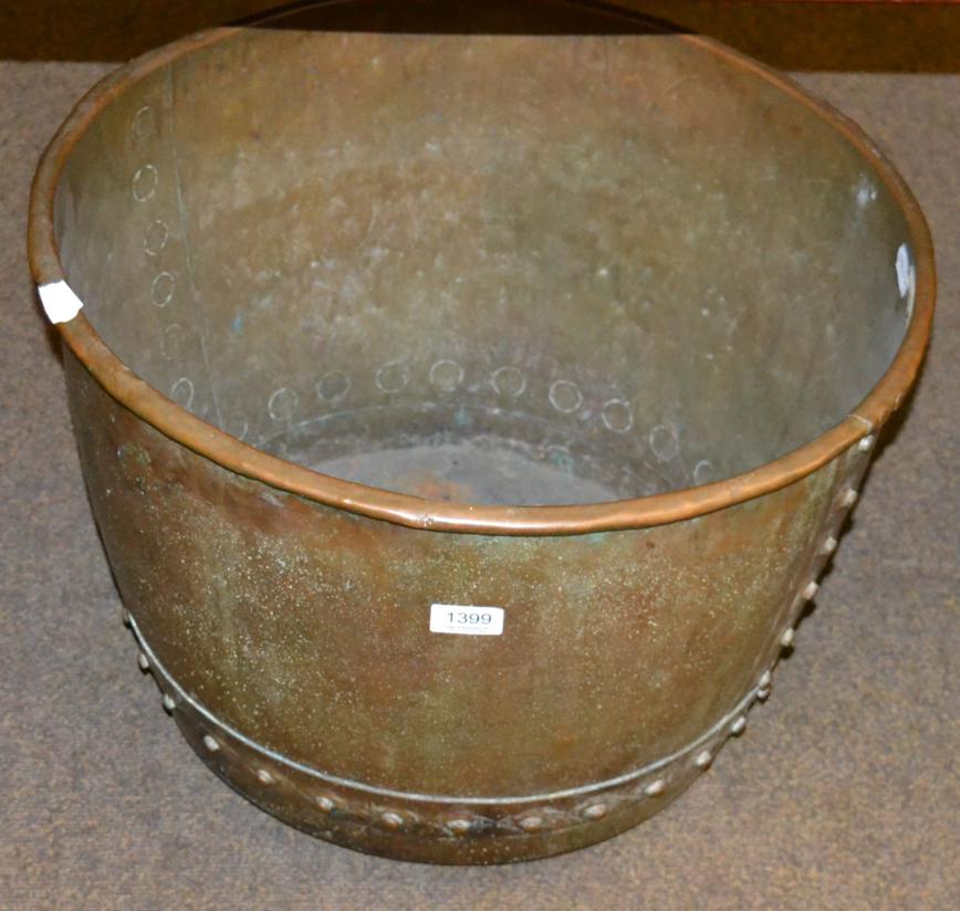 A riveted copper log bin