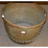 A riveted copper log bin