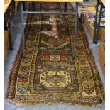 North West Persian runner, the field with a column of medallions enclosed by ivory borders, 354cm by