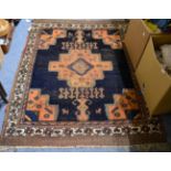 An Afshar rug, South West Iran, the deep indigo field with cruciform medallion framed by spandrels