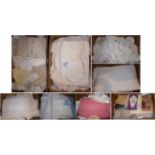 Eight boxes of assorted white linens, embroidered textiles, crochet trims and edgings, table linen