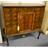 A walnut cocktail cabinet