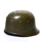 A Rare First World War Turkish Helmet, cut down from a German M17 helmet, with uneven rolled edge,