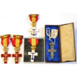 Five Spanish Crosses of Naval Merit, comprising two with Red Decoration, two with White Decoration