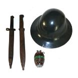 A Collection of Militaria, comprising a Brodie helmet, painted grey, stamped ''M'' to the brim