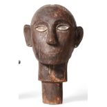 A Late 19th/20th Century Batak Ceremonial Wood Head, Sumatra, of human size, the skull with a carved
