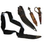A Nepalese Kukri, with wood grip and leather scabbard; a Sudanese Arm Dagger, with wood grip and
