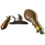 A Copper Powder Flask, embossed with leaves and fluting, the brass charger with internal spring,