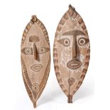 Two Highlands Shields/Spirit Boards, Papua New Guinea, each as an elliptical mask with shallow