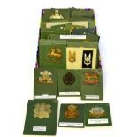 A Collection of Sixty Seven British Military Badges, including cap, glengarry and collar, in
