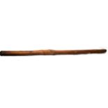 A 19th Century Australian Aboriginal Didgeridoo, of a dense red wood with chip carving to the