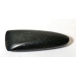 A Highlands Black Stone Axe Head, Papua New Guinea, of typical form, 24cm by 8cm